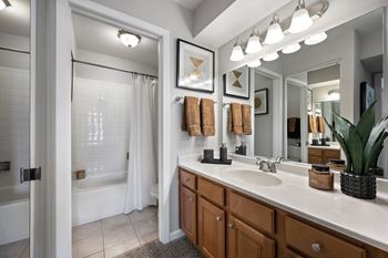 New designer baths with maple cabinetry, marble vanity tops, and brushed nickel fixtures